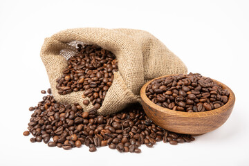 Coffee beans in bowl and burlap isolated on white background.