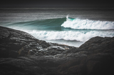 Wild Turquoise Wave Breaks along the West Coast in Tofino Storm Season