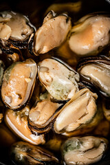 Delicious pickled mussels. Macro background.