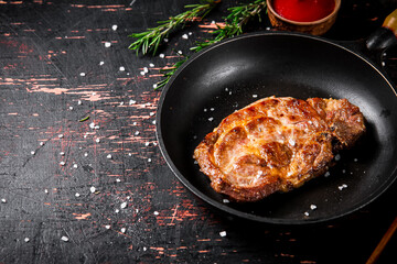 Frying pan with grilled steak. 