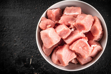Chopped raw pork in a bowl. 