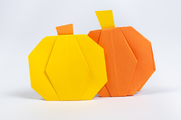 Halloween DIY Origami - Yellow and Orange Paper Pumpkins on a White Background