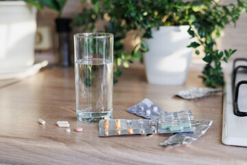 pills and vitamins on table, drink omega and oil in morning, maintaining health of the body and soul. vitamin c, level of iron in blood. strength and activity