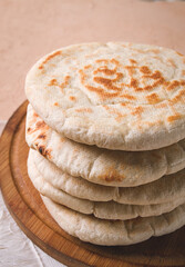 Pita bread, stack, on the table, no people,