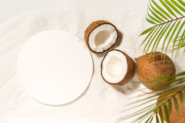 Beauty cosmetics product presentation scene made with round mockup podium and cocounuts on a sand.