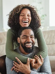 Fotobehang woman couple man happy happiness  love black young lifestyle together romantic boyfriend girlfriend laughing hug © Lumos sp