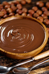 Hazelnut butter in a plate on a cutting board. 
