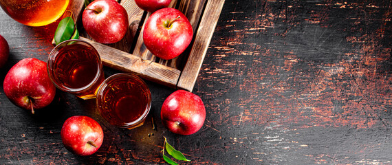 A glass of apple juice on the table. 