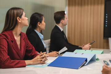group of businesspeople sitting together in a meeting for best ideas, International executive team people having board discussing project results. Diverse employees group working with senior worker