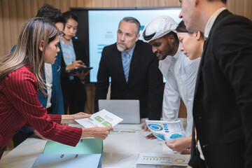 group of businesspeople sitting together in a meeting for best ideas, International executive team people having board discussing project results. Diverse employees group working with senior worker