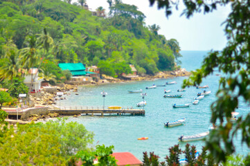 Yelapa Mexio dock with boats on tropical island in summer