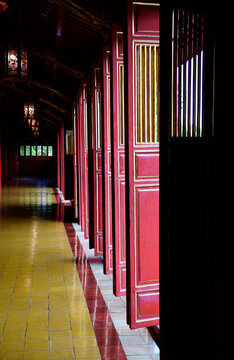 Wooden red doors inside Hue Emperors Citadel in Hue, Vietnam on October 9, 2022 © hippomyta