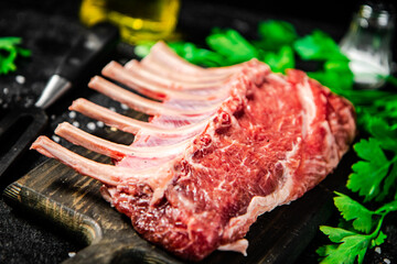 Raw rack of lamb with parsley and oil. 