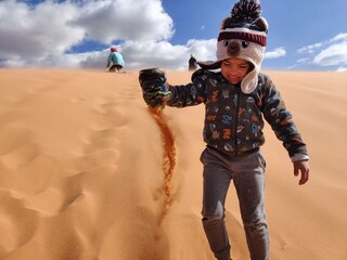 Pouring sand from a shoe. 