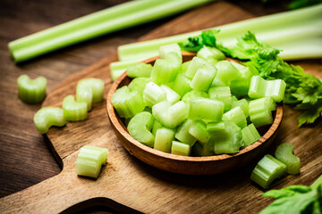 Sliced fresh celery on a cutting board. 