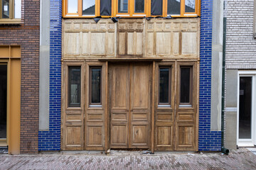 Sustainable new house in the center of the city of Deventer with a facade of wood and blue stones