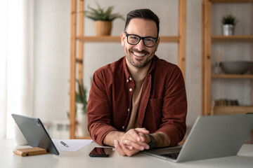 Happy smiling bearded businessman with glasses small business owner, company leader or sales...