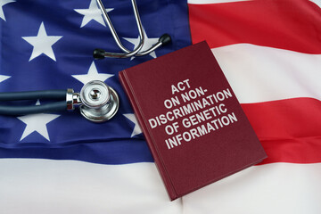 On the US flag lies a stethoscope and a book with the inscription - ACT ON NON-DISCRIMINATION OF...