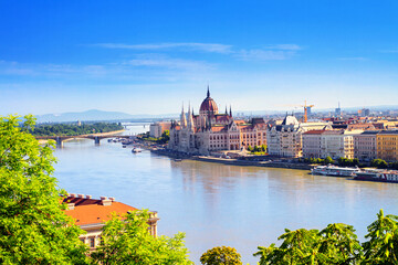 Fototapeta premium City summer sunset landscape - view of the Hungarian Parliament Building and Danube river in the historical center of Budapest, Hungary