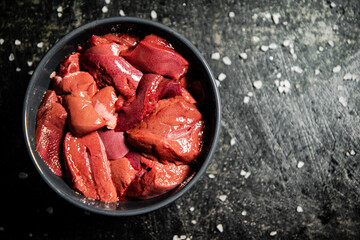 Sliced raw liver in a bowl. 