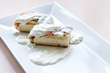 cottage cheese dessert poured with plenty of sour cream with rustic dessert, delicious food healthy food, sour cream and homemade cottage cheese Who has a cow Home cooked delicious