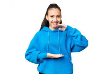 Young Arabian woman over isolated chroma key background holding copyspace imaginary on the palm to insert an ad