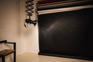 Professional equipment in a modern photo studio. Lighting dark background