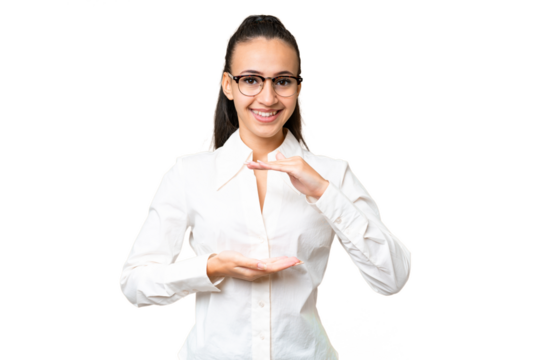 Young Arabian woman over isolated chroma key background holding copyspace imaginary on the palm to insert an ad