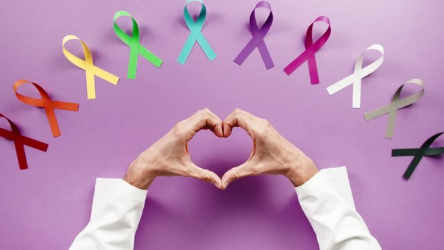 Doctor making an heart for world cancer day flat layer background