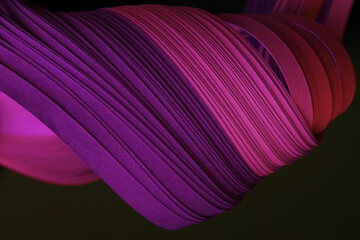 Neon Pink Violet color strip wave curve paper lineon black. Abstract texture background.