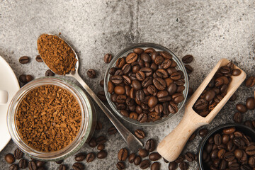 A cup of fragrant espresso coffee, instant coffee and coffee beans on a black stone background. Place for text. Space for copy text