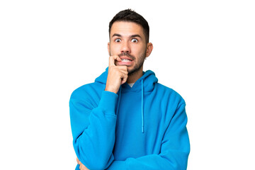 Fototapeta premium Young handsome caucasian man over isolated chroma key background nervous and scared