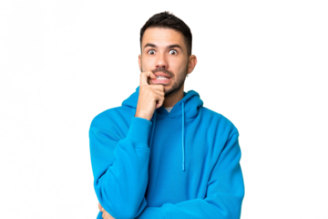 Young handsome caucasian man over isolated chroma key background nervous and scared