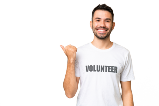 Young volunteer caucasian man over isolated chroma key background pointing to the side to present a product - Powered by Adobe