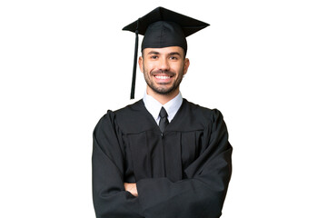 Young university graduate man over isolated chroma key background keeping the arms crossed in...