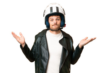Brazilian man with a motorcycle helmet over isolated chroma key background having doubts while raising hands