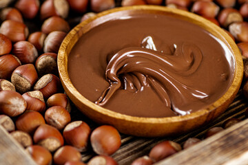 Hazelnut butter on a wooden plate. 