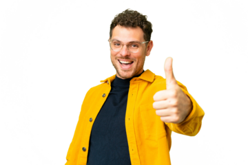 Brazilian man over isolated chroma key background with thumbs up because something good has happened