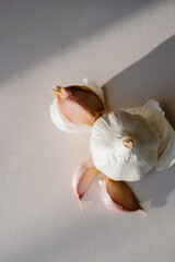 Peeled Organic Garlic Detailed Closeup in afternoon sunlight.