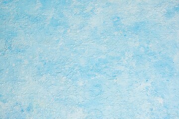 Light blue concrete or stone wall. Blue concrete background. Copyspace, top view. Blank for design