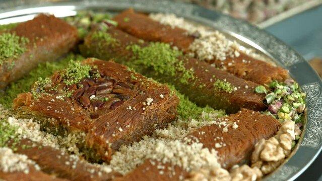 Traditional turkish baklava pistachio pastry. Dilberdudagi, ozel kesim baklava, cikolatali baklava, fistikli baklava, katmer, fistikli kadayif, kattafi, fistik sarma, soguk baklava, midye baklava, cev