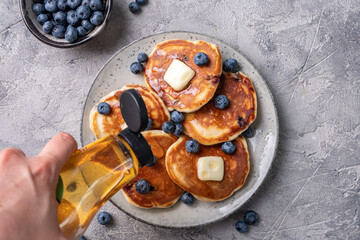 Buttermilk blueberry pancakes with maple syrup