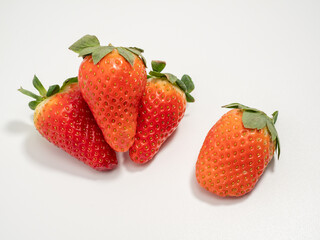 Ripe strawberries on a white background. Strawberries close up.