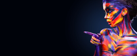 Portrait of the bright beautiful girl with art colorful make-up and bodyart