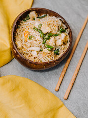 Chicken vermicelli in a bowl with chopsticks