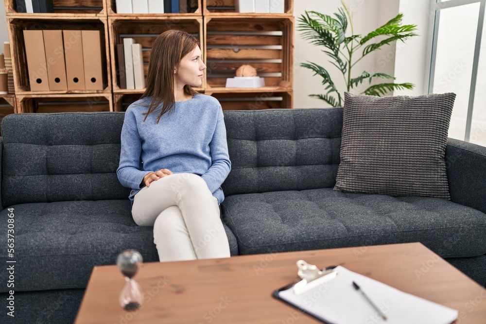 Sticker young brunette woman at consultation office looking to side, relax profile pose with natural face wi