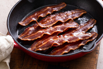 Turkey bacon cooked on a cast iron pan