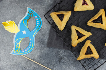 Jewish holiday Purim celebration concept. Traditional hamantasch or hamantaschen Haman's ears...