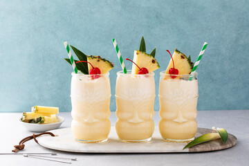 Tropical pina colada cocktail or mocktail in a tiki glass
