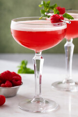 Raspberry martini cocktail with vodka, juice and raspberry liqueur